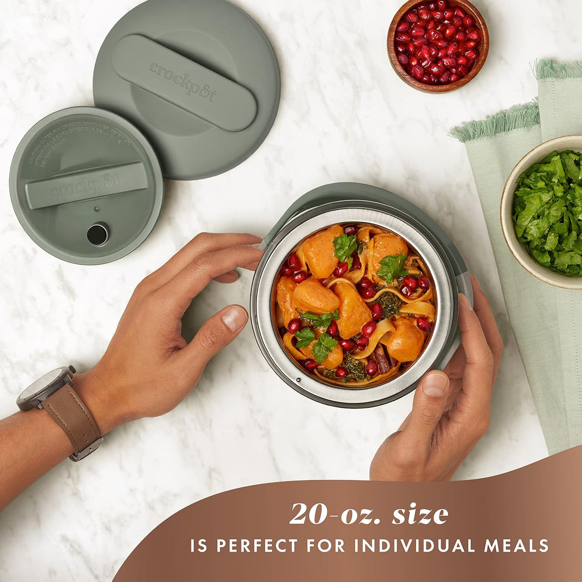 Green electric food warmer with carry handle and rounded design