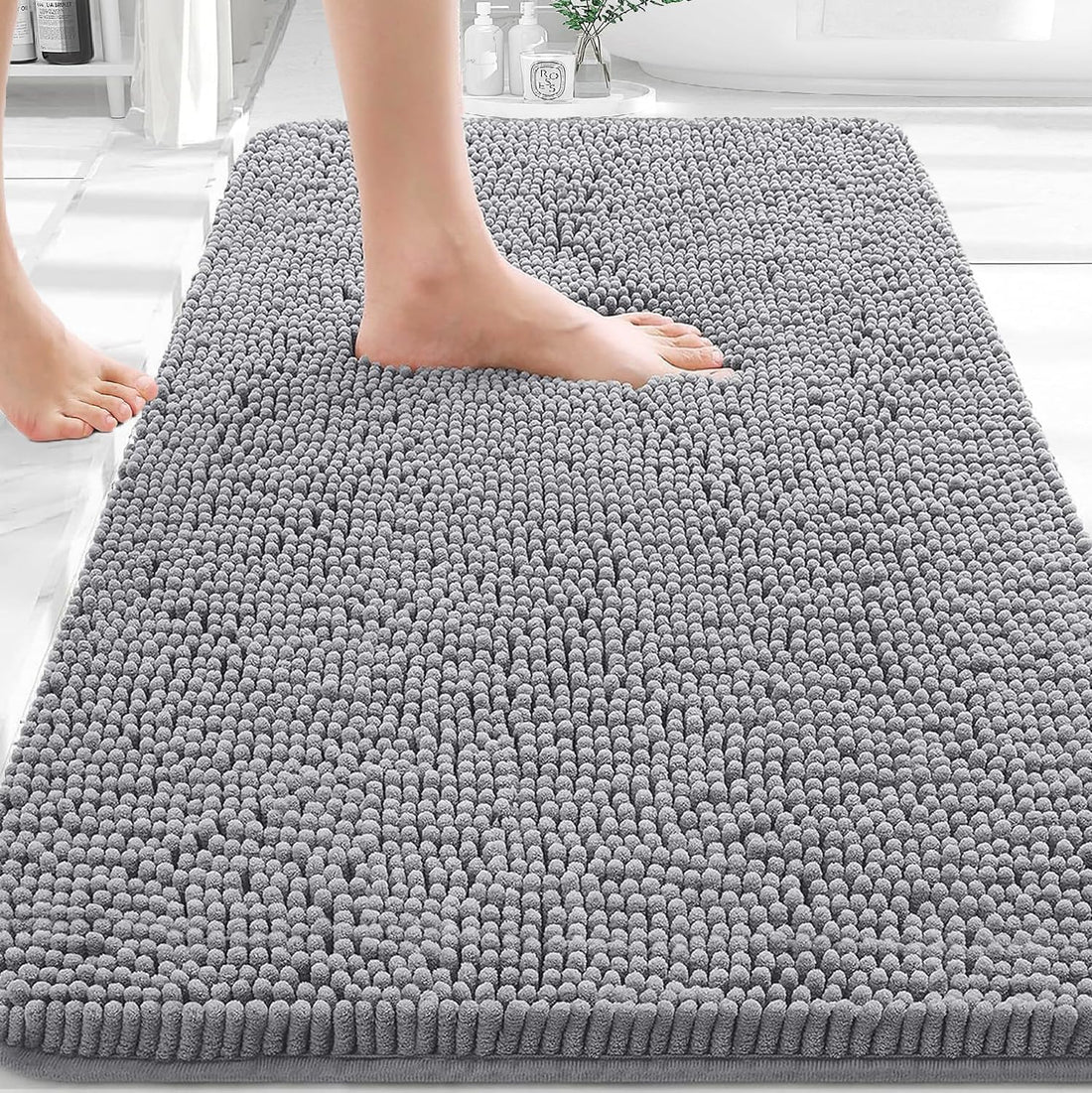 Plush bath mat designed to absorb everyday bathroom moisture