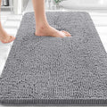 Plush bath mat designed to absorb everyday bathroom moisture