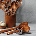 Cooking spoon resting in a silicone utensil holder during meal preparation