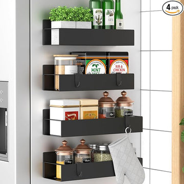Set of four black wall-mounted spice racks for kitchen storage