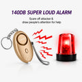 Gold personal safety alarm keychain with central button and wrist strap