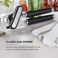 Manual can opener used to open a food can in the kitchen