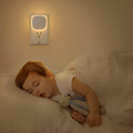 Compact motion sensor night light for illuminating a dark hallway