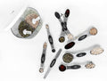 Kitchen measuring spoons with visible measurement markings for recipe preparation